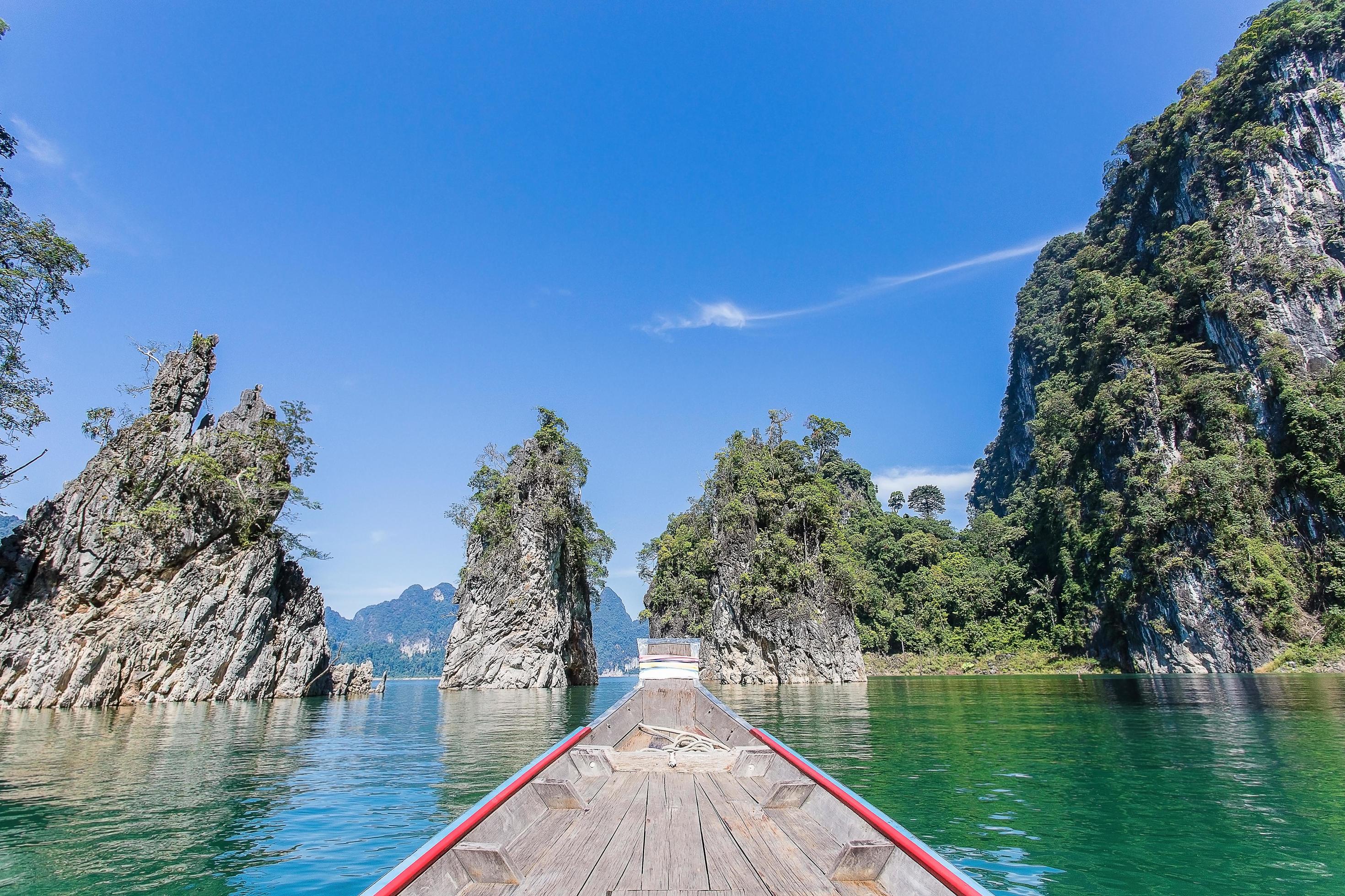 Beautiful natural mountains from a long tailed boat in Ratchaprapha Dam at Khao Sok National Park, Surat Thani Province, Thailand. Stock Free