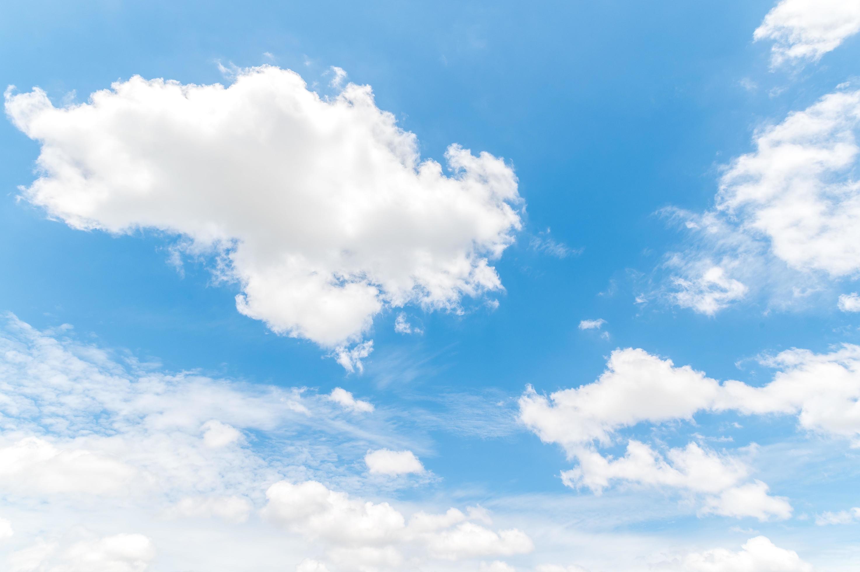 Beautiful white fluffy clouds in blue sky. Nature background from white clouds in sunny day Stock Free