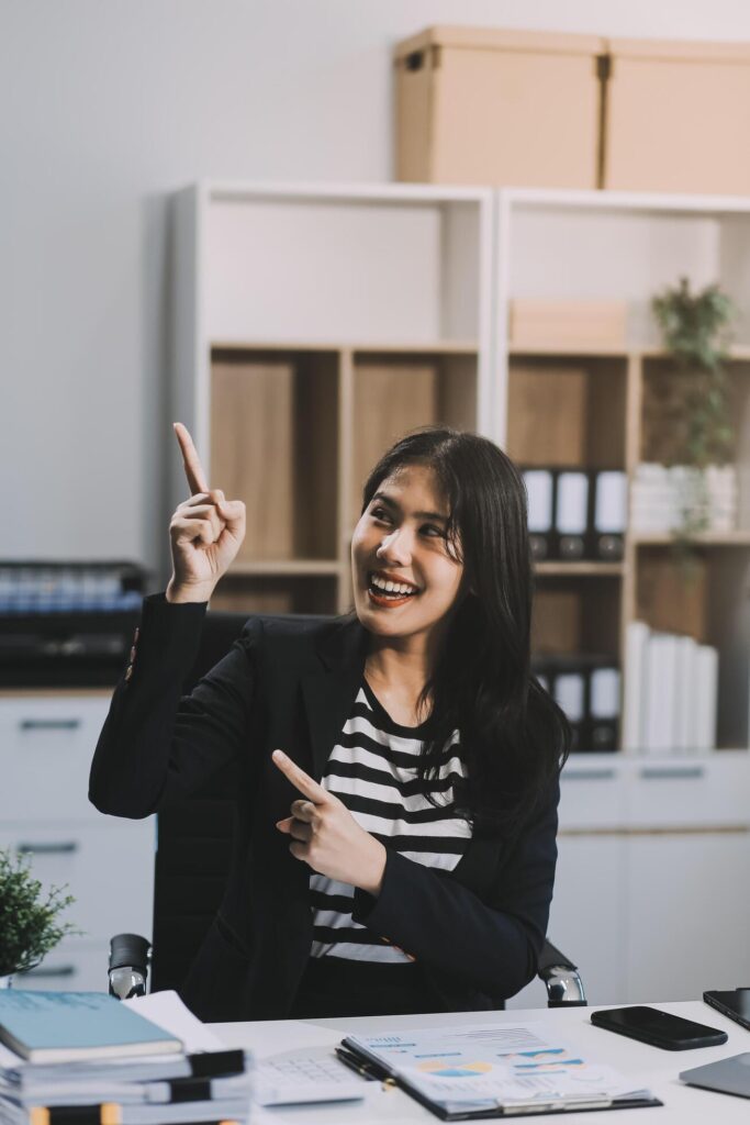 Young pretty business woman with notebook in the office Stock Free