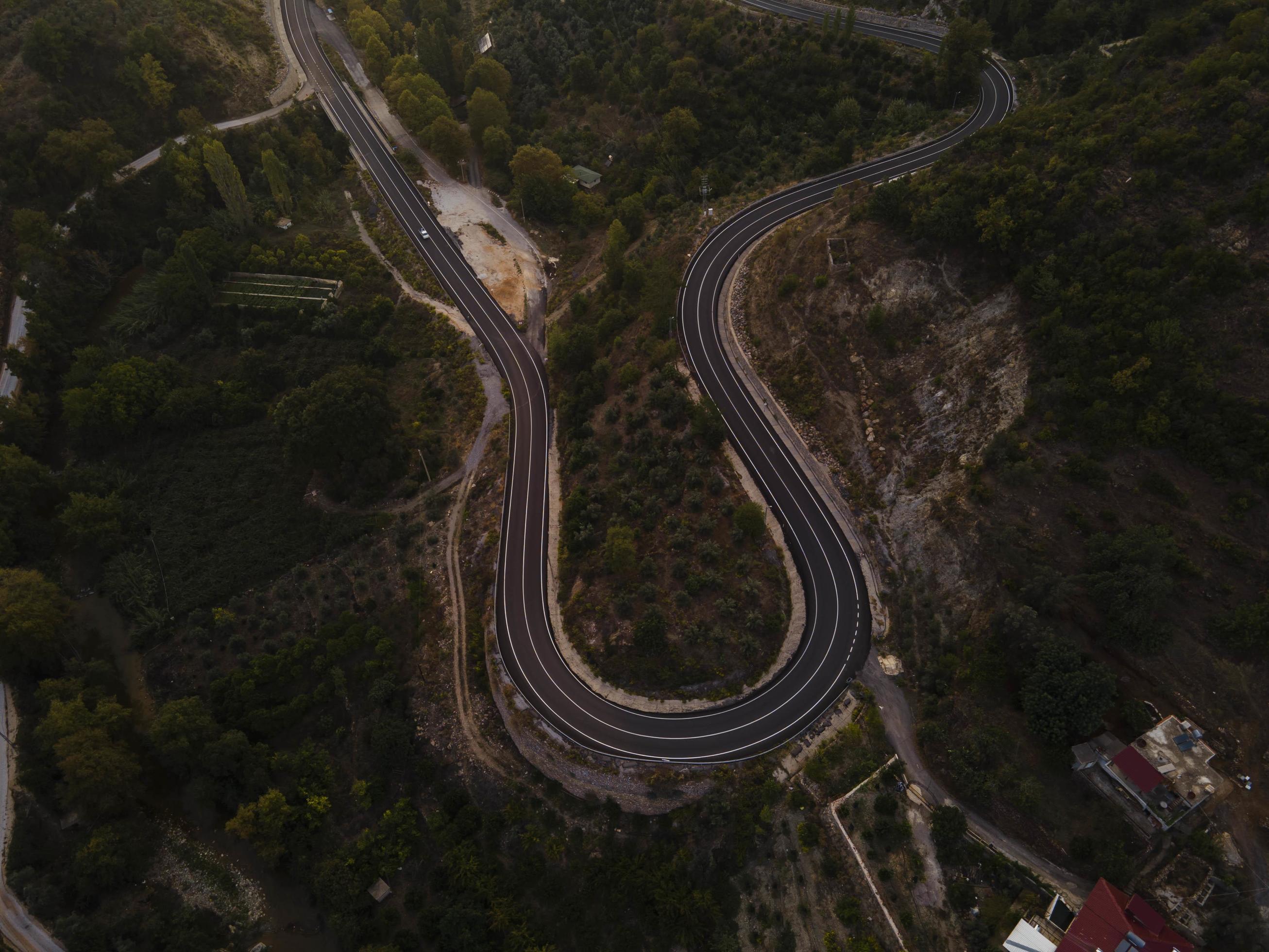 aerial valley and road, Top view, amazing nature background. sunset Flying drone, seascape Stock Free