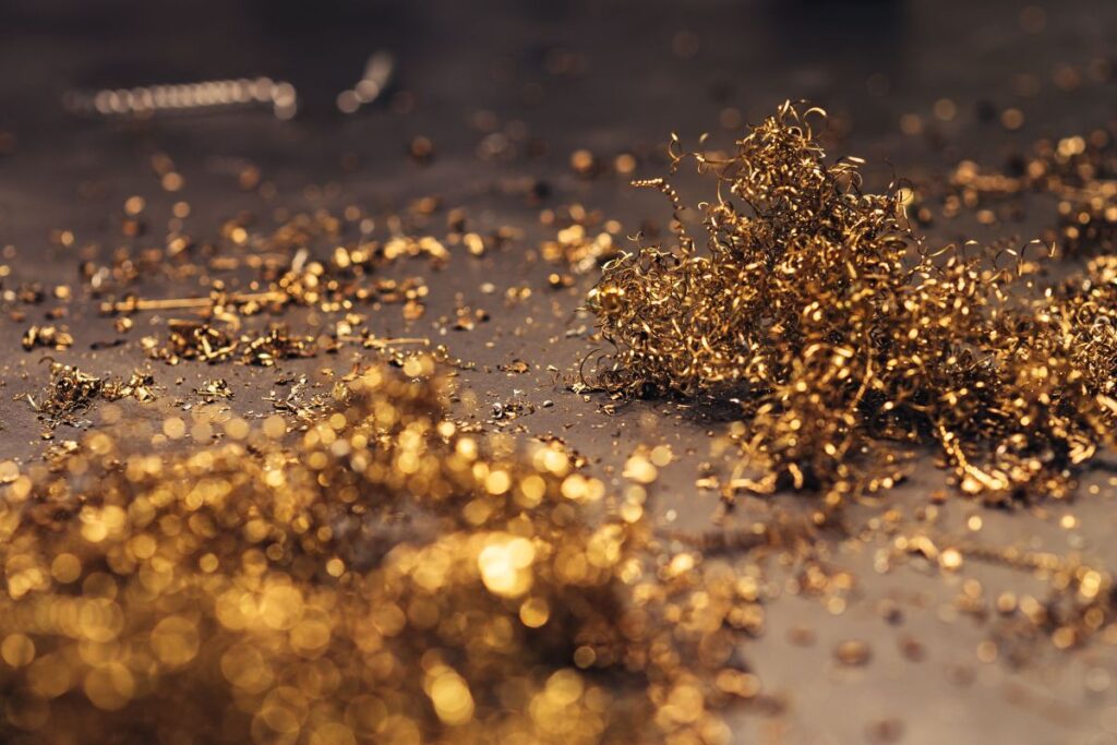 Close-ups of golden metal shavings on a table Stock Free