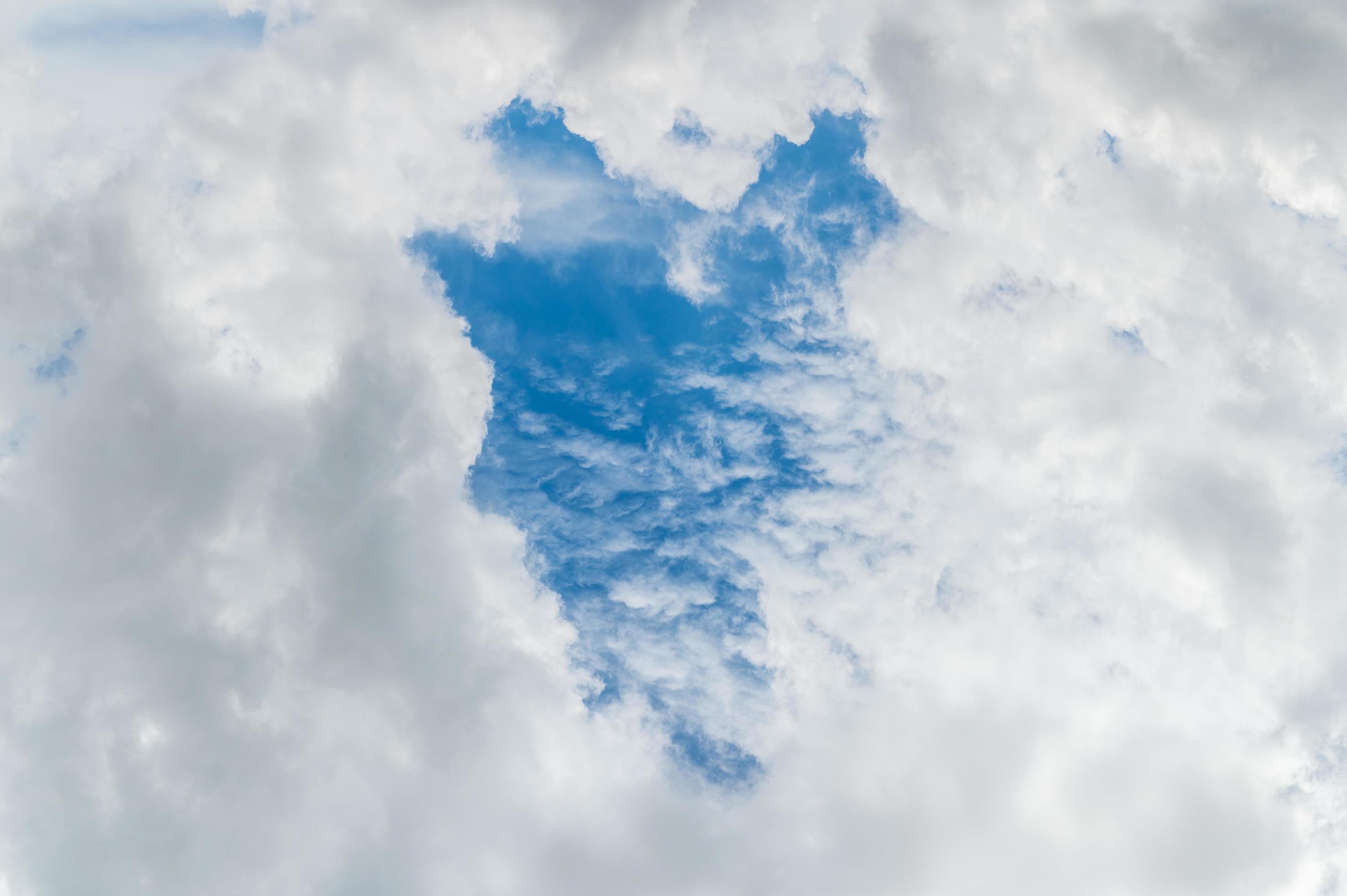 Beautiful white fluffy clouds in blue sky. Nature background from white clouds in sunny day Stock Free