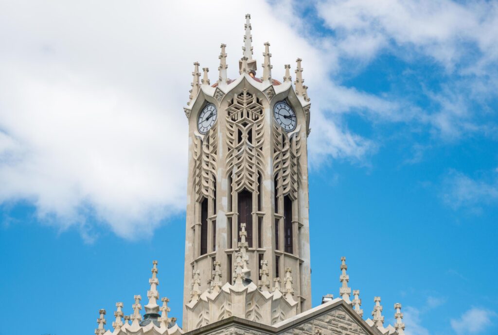 The clock tower of an Old arts building in the University of Auckland is the largest university in New Zealand. Stock Free