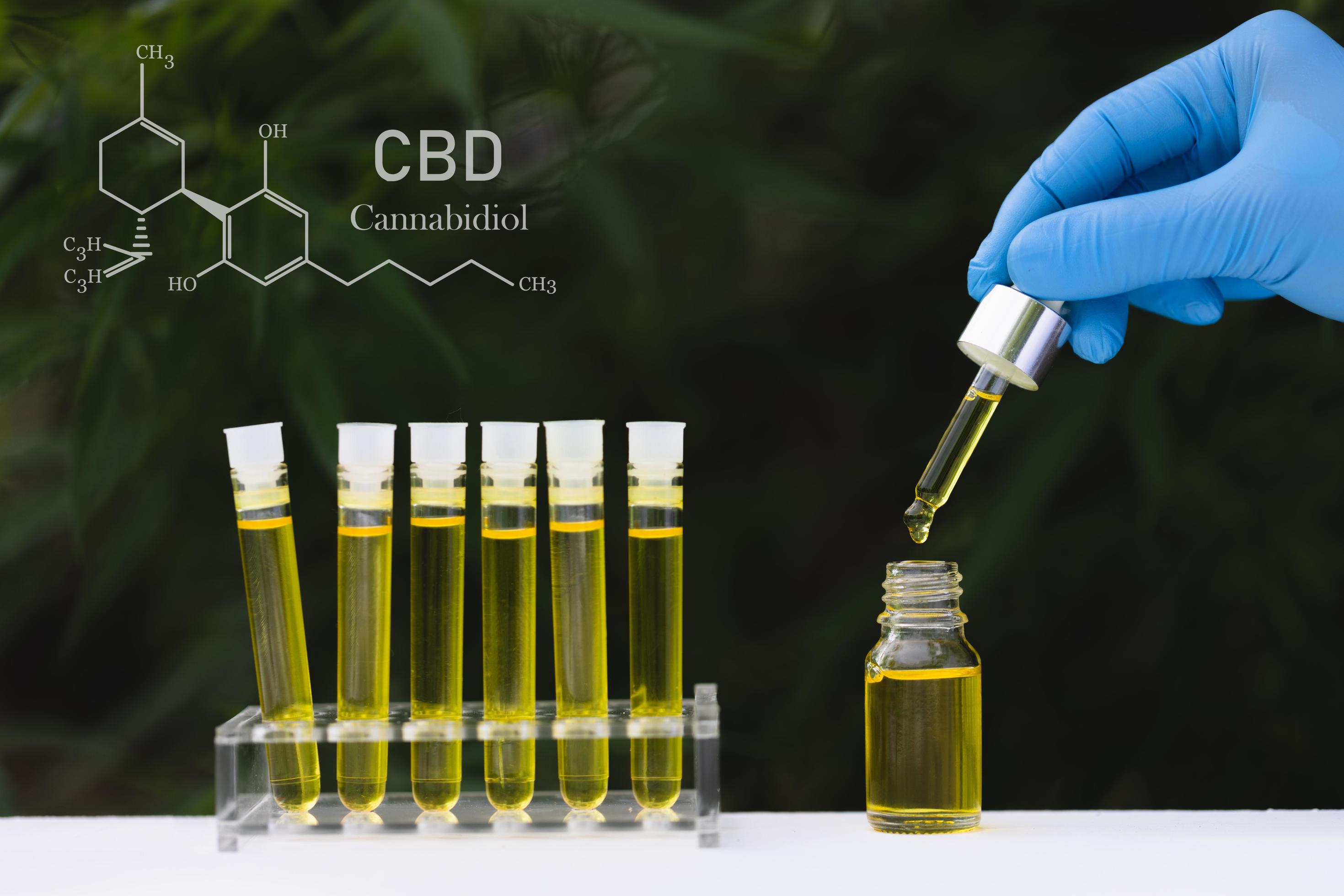 Cannabidiol CBD Oil Chemical Formula. A drop of hemp oil that comes out of the hemp leaf, Medical cannabis concept. Stock Free