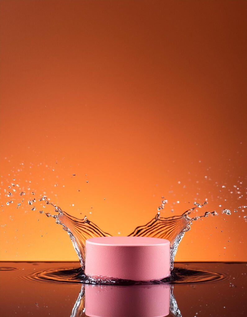 empty pink podium mockup with water splash on a orange gradient background for product display Stock Free