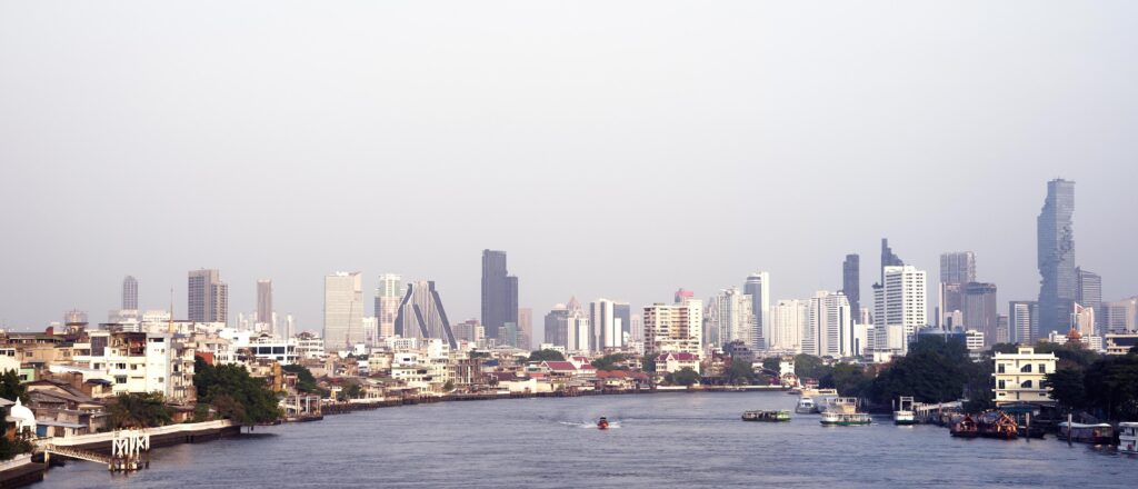 Bangkok, cityscape building with river and boat background. skyline Stock Free