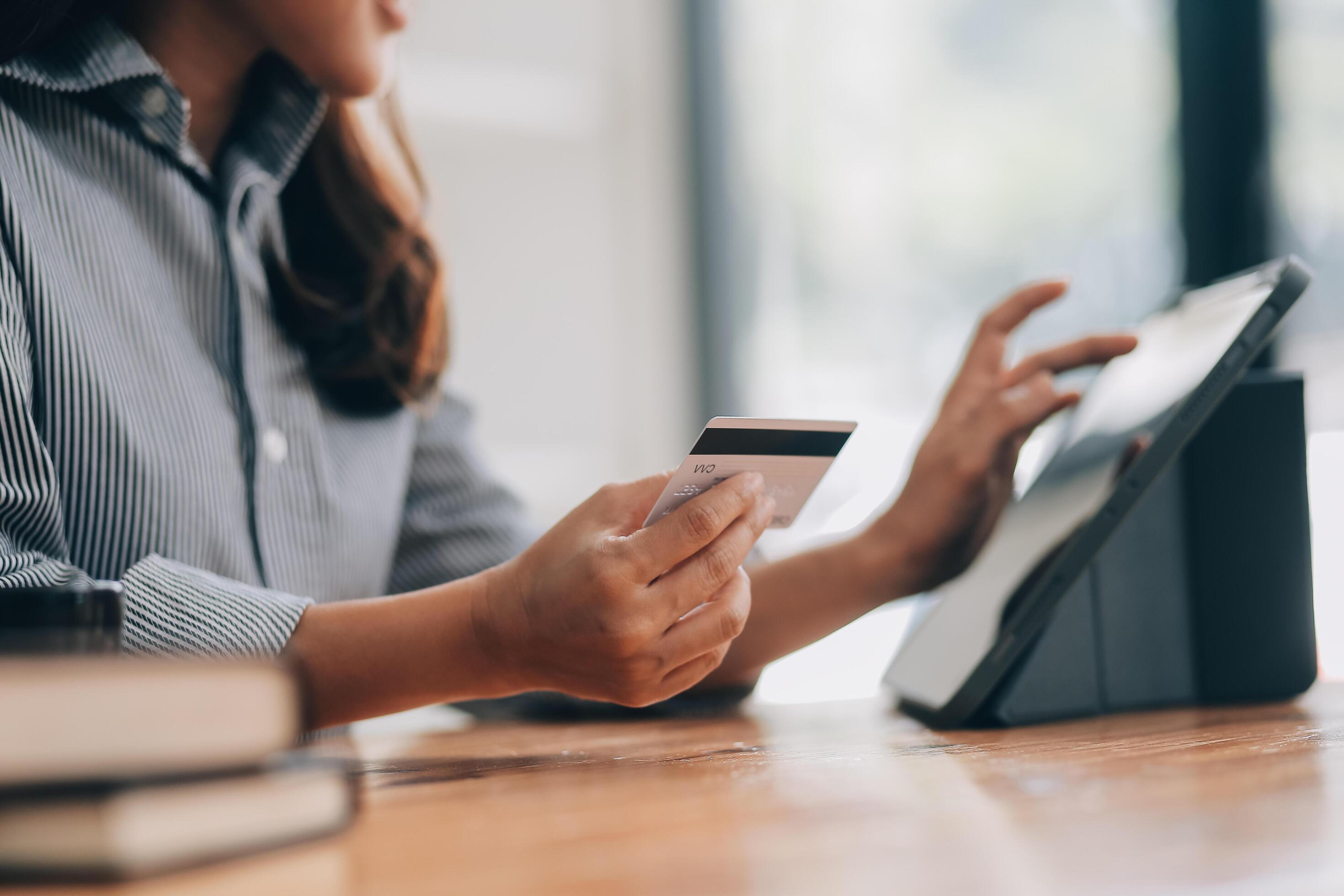 Happy asian woman using smartphone shopping online with credit card. Lifestyle. Easy pay using smart phone or digital device. Stock Free