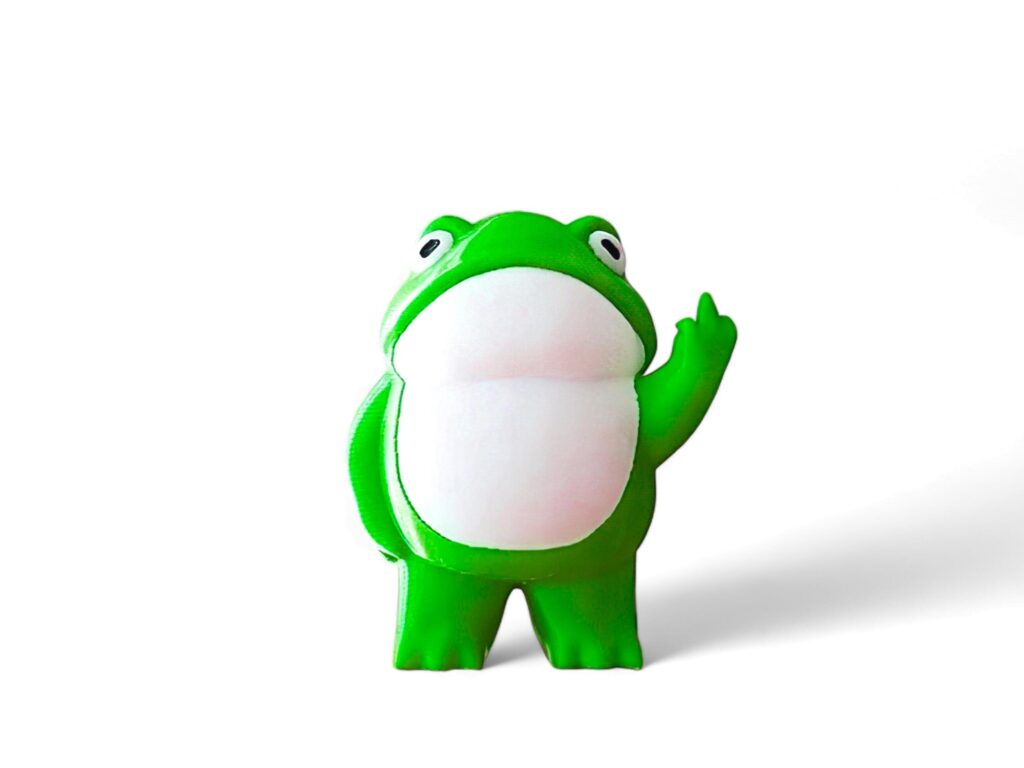 Miniature green frog on a white background Stock Free