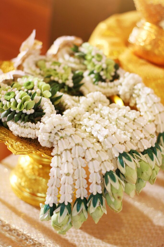 Flower garlands on a gold tray in tradition Thai wedding ceremony day. Jasmine garland. Stock Free