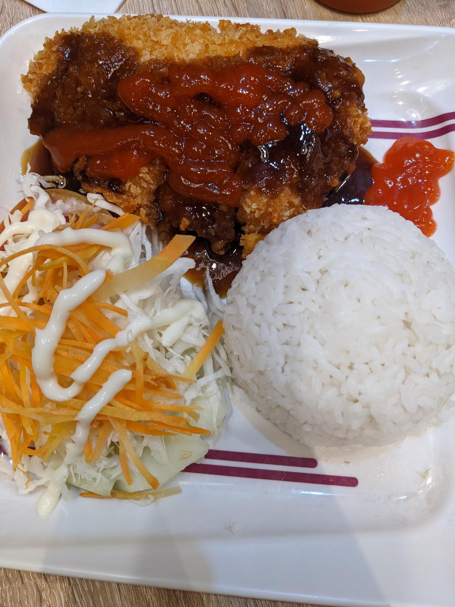 Close up photo of spicy chicken lava with cheese sauce and rice on restaurant. The photo is suitable to use for food background, poster and food content. Stock Free