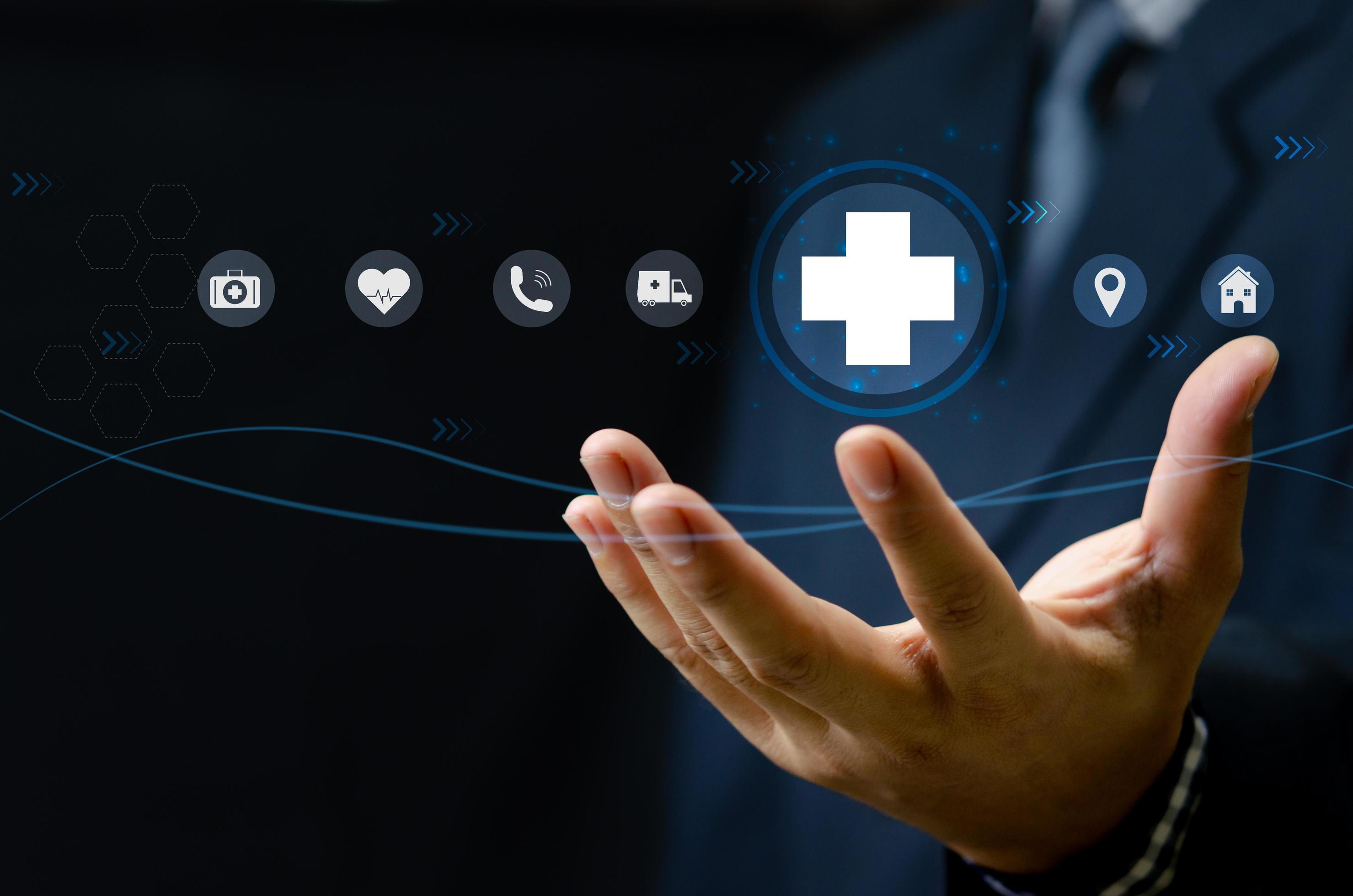 Man hand holding virtual medical health care icons with medical network connection.Business insurance. Stock Free