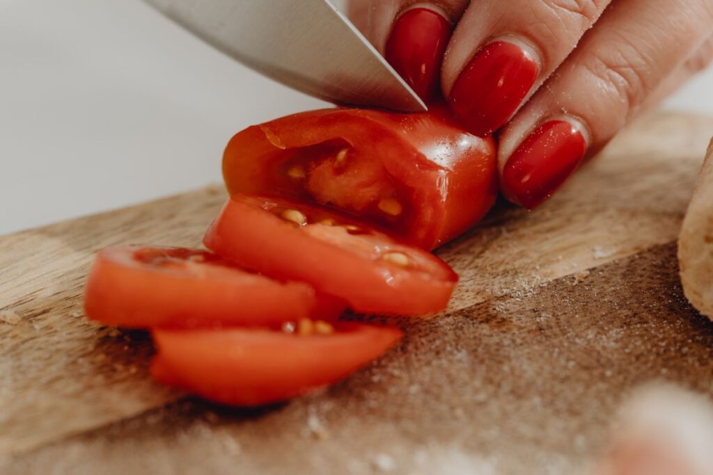 Woman making bruschetta with healthy ingredients Stock Free