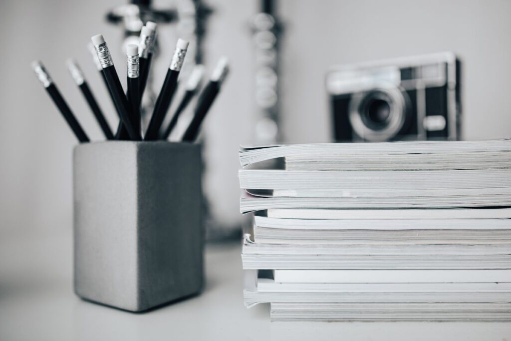 Pencils, magazines and an old lightbulb Stock Free