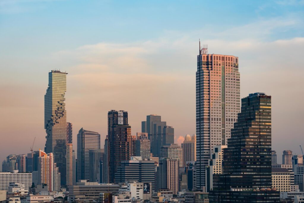 Cityscape of skyscraper of Bangkok city at sunset Stock Free