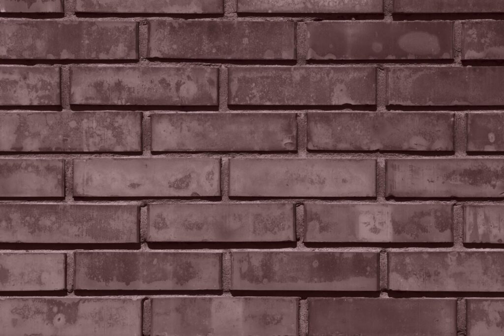 brick wall background colored in deep taupe color Stock Free