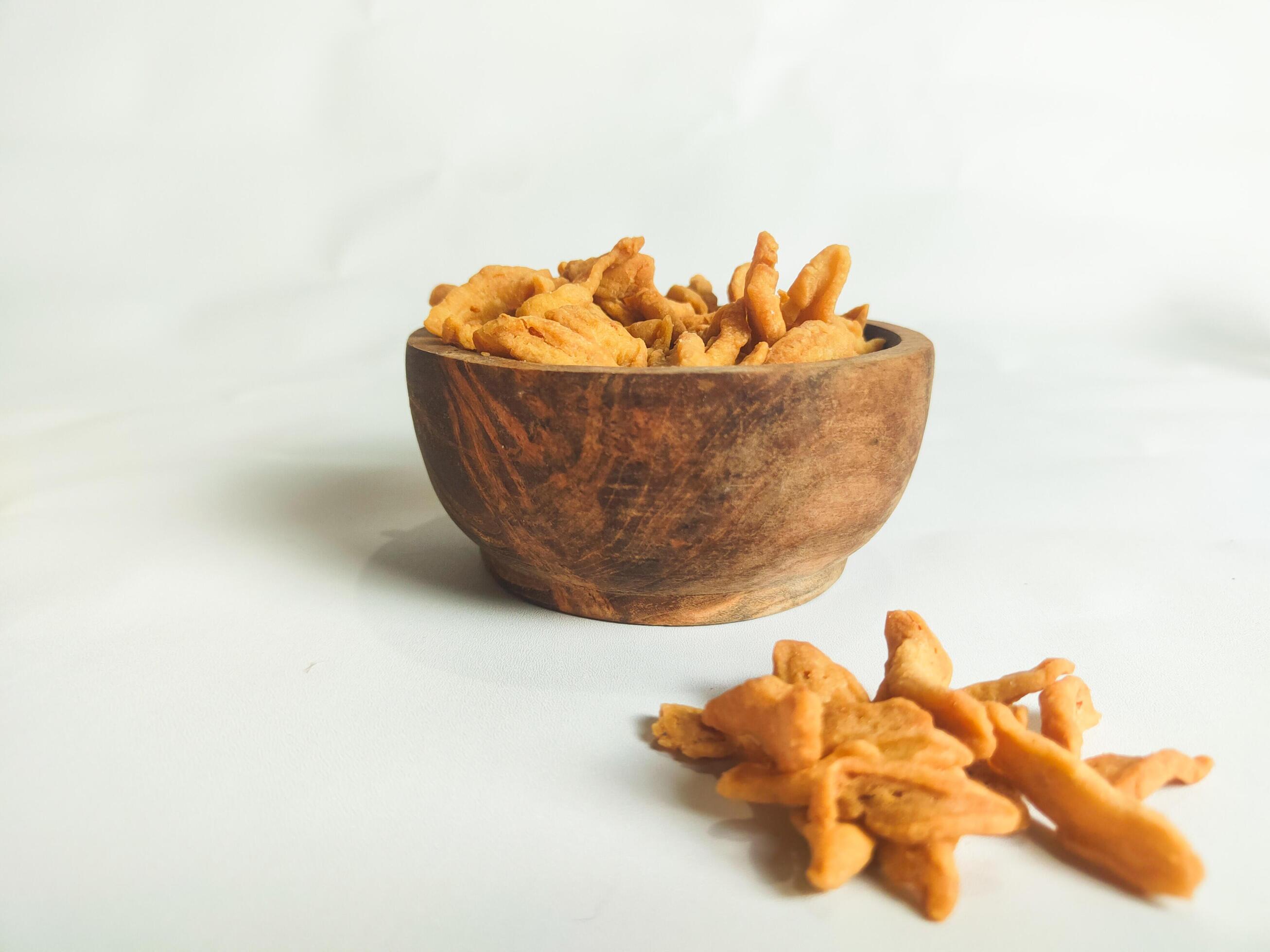 photography of cimi-cimi snack food in a wooden bowl on a white background Stock Free