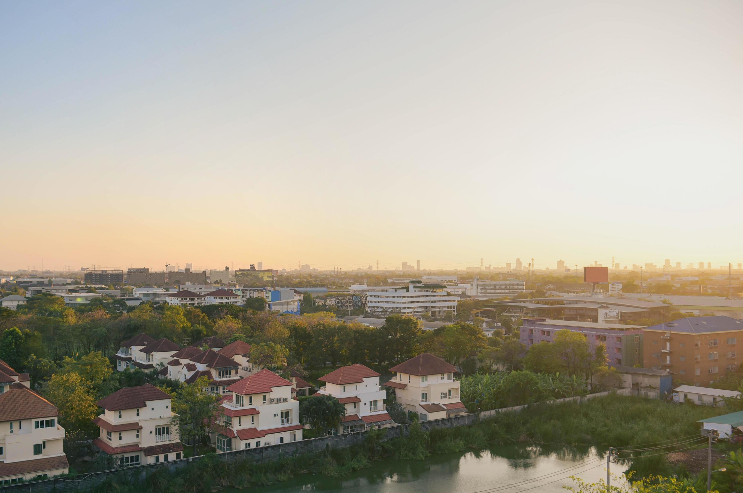 Wide angle landscape village in nature at bangkok Thailand with sunset background. Stock Free