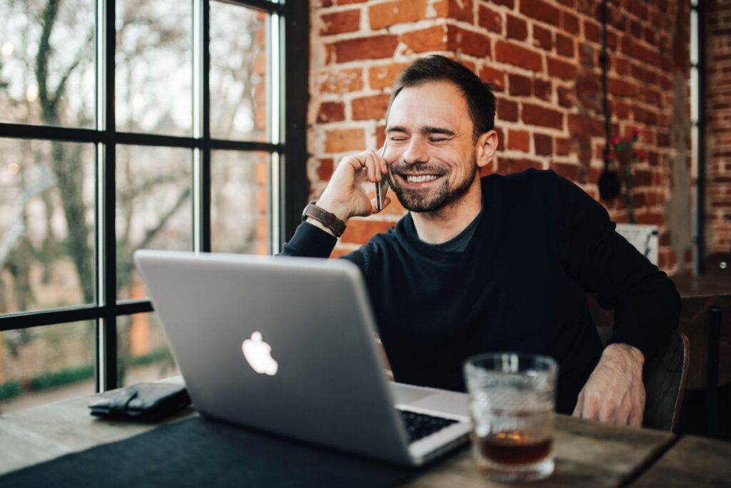 Young Entrepreneur Working from a Modern Cafe Stock Free