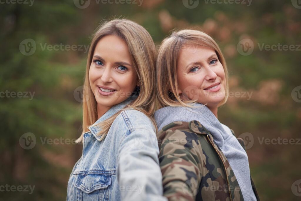 Two girl friends or lgnt couple in wood Pro Photo