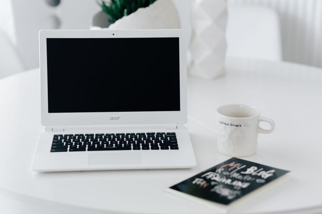 Workplace with laptop on table at home Stock Free