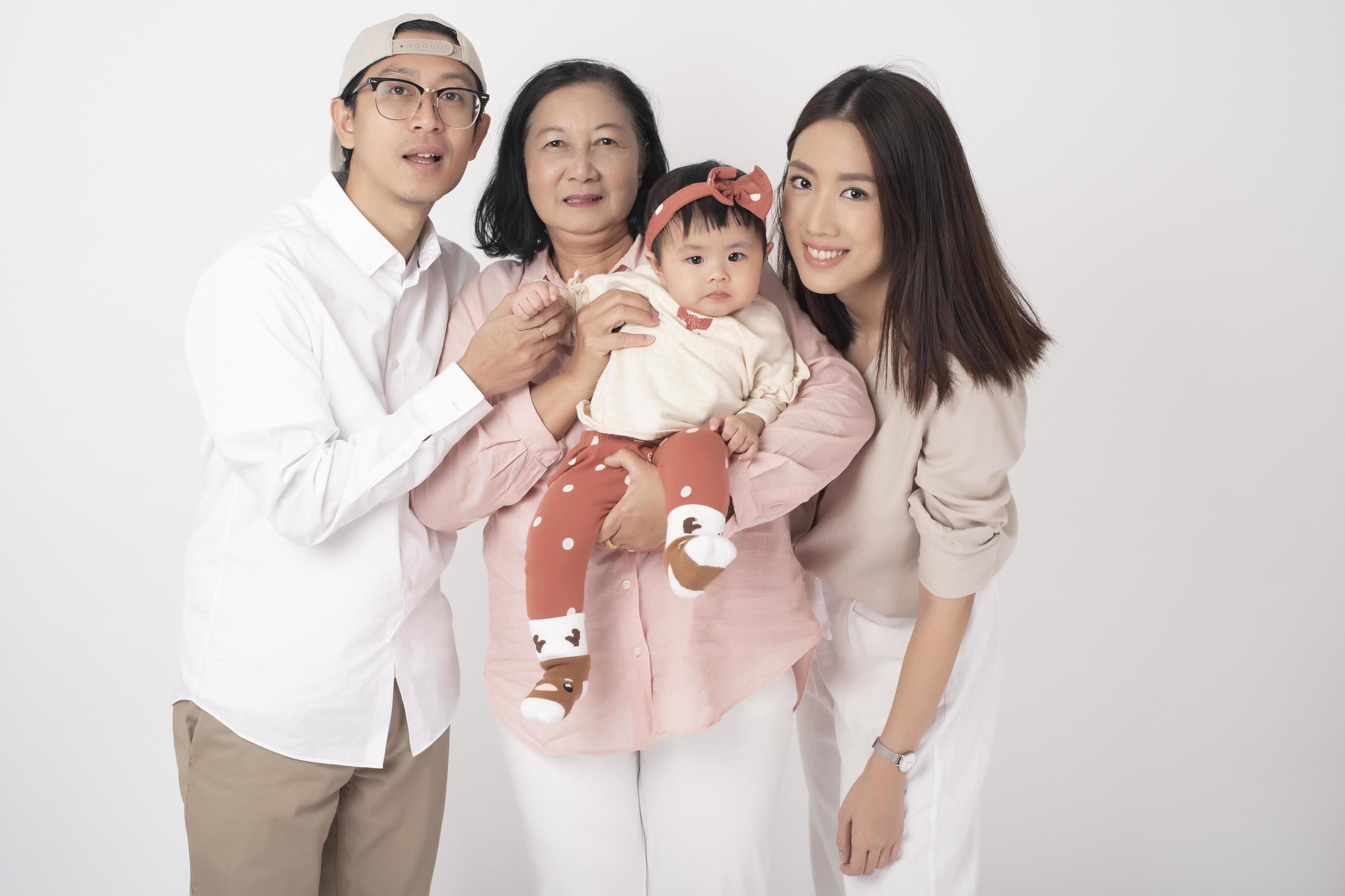 Happy Asian family on white background Stock Free