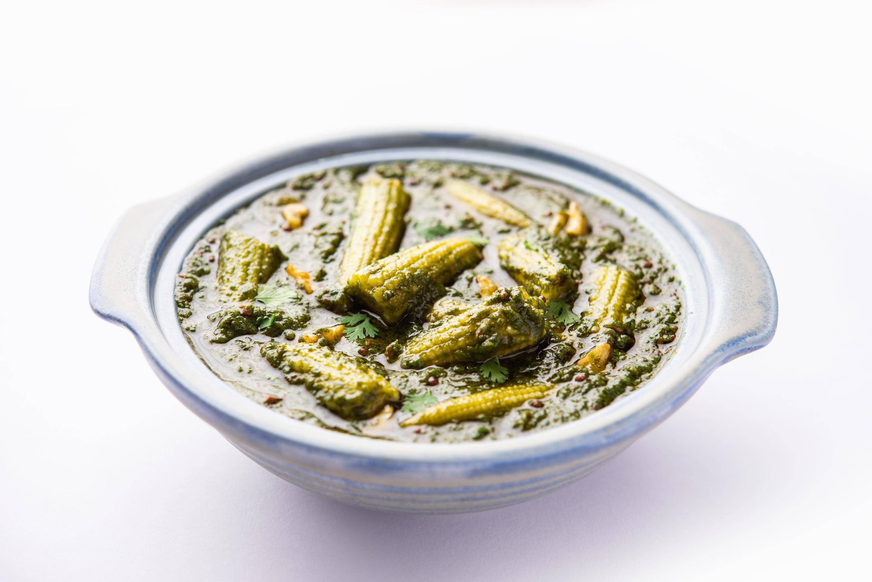 palak baby corn sabzi also known as spinach makai curry served with rice or roti, Indian food Stock Free