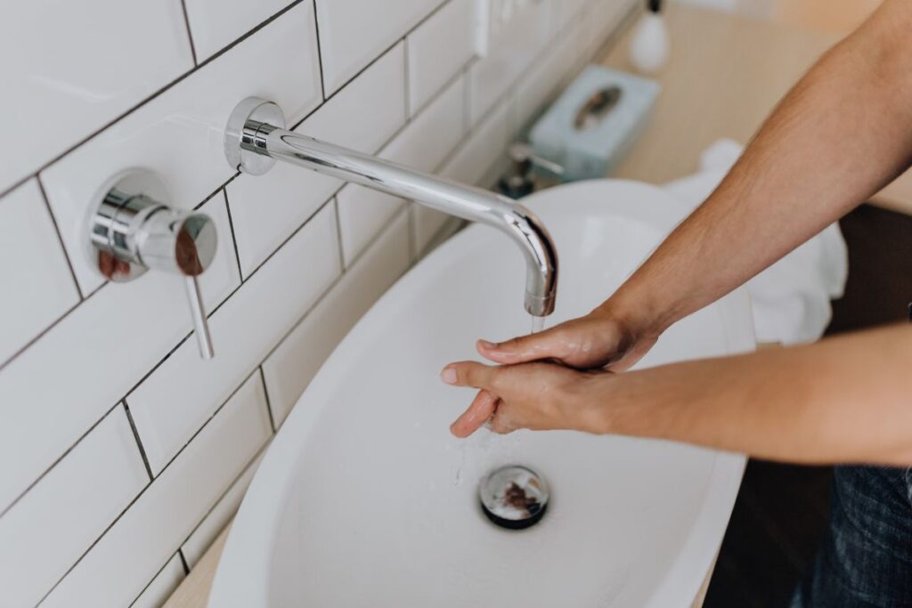 
									Washing of hands under running water Stock Free