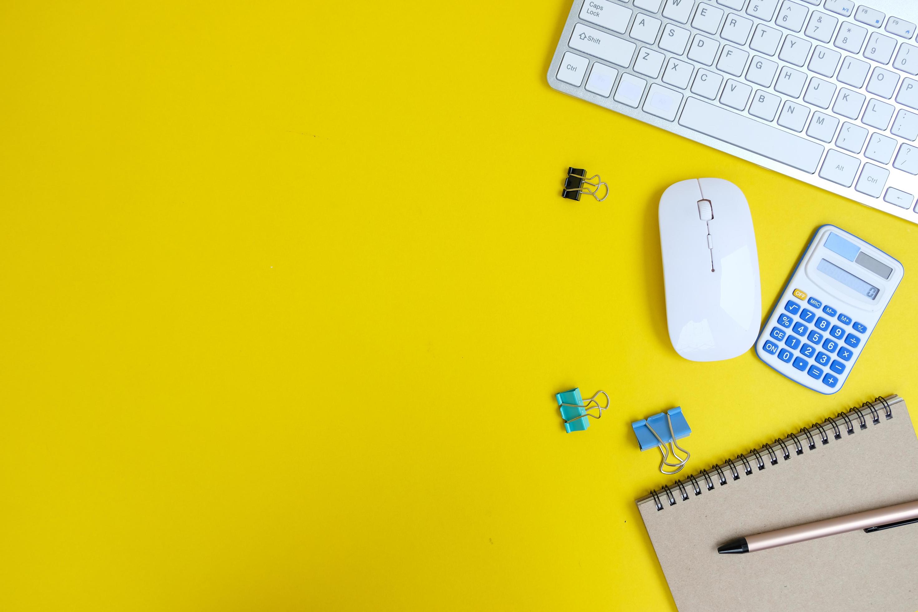 Laptop, smartphone, and supplies on a black office desk table. Computer tools on a desk table in the office, Top view with copy space, flat lay. Stock Free