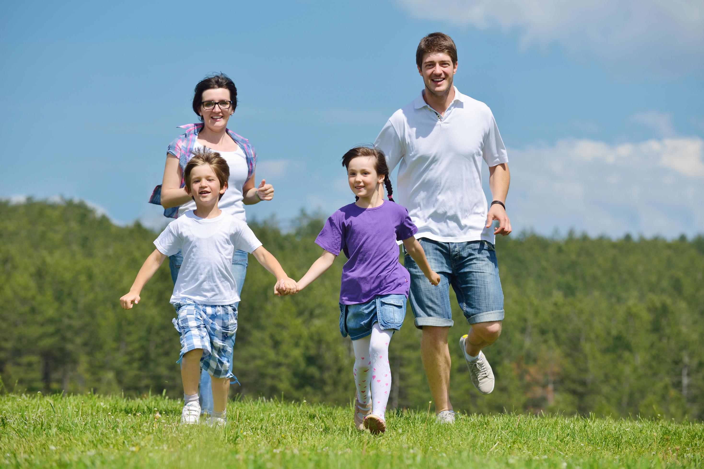 happy young family have fun outdoors Stock Free