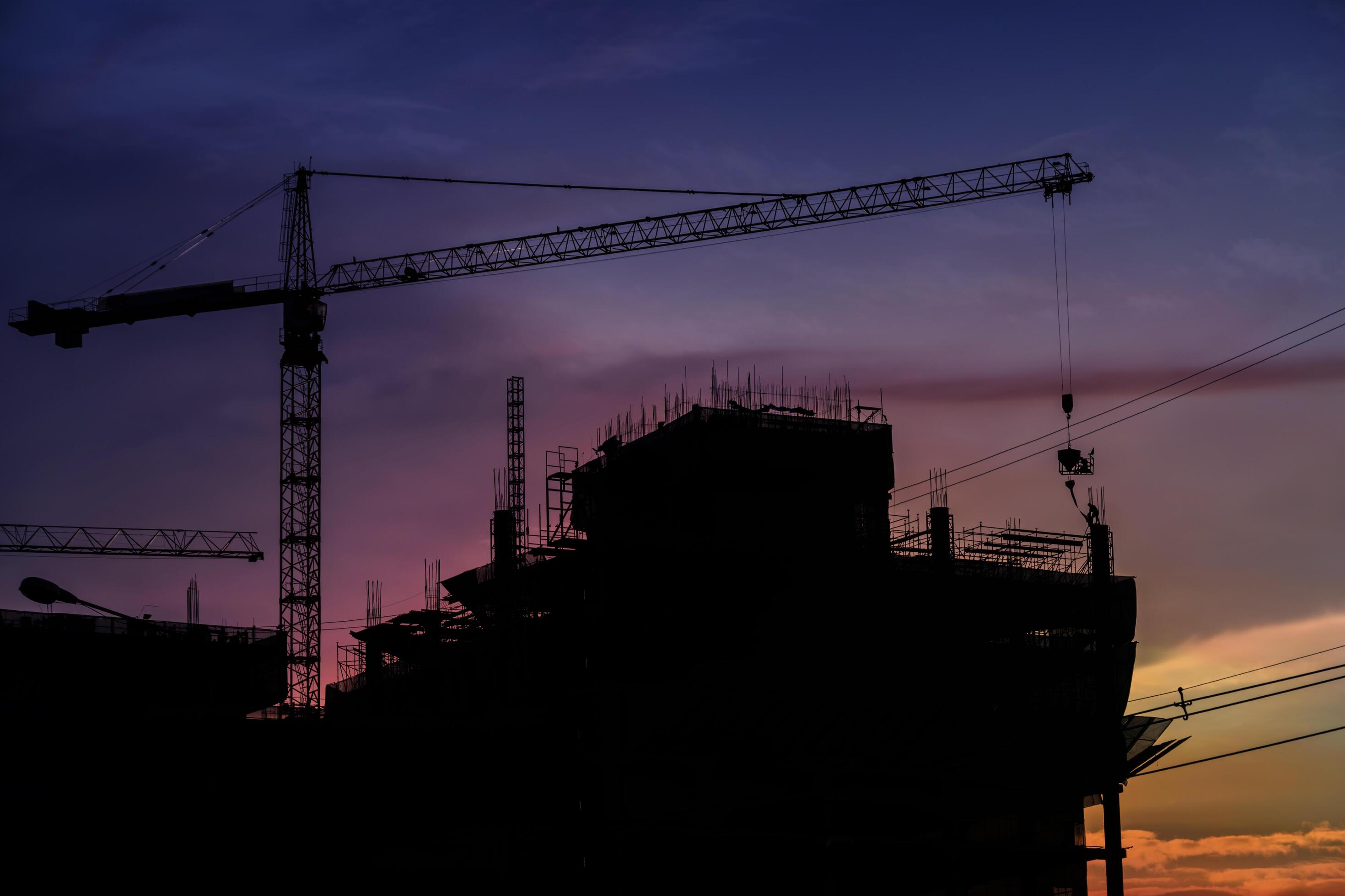 The large construction project is a business investment that has grown in a good direction. Silhouette concept Stock Free