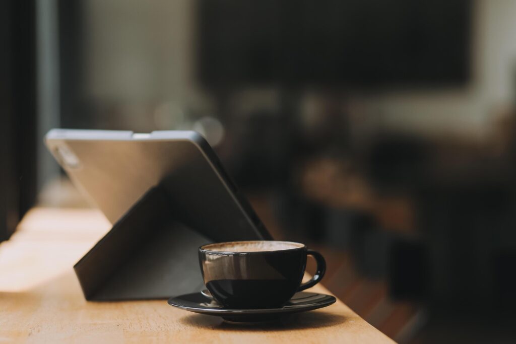 Coffee Cup on the Table with Computer Keyboard for Business Concept. Stock Free