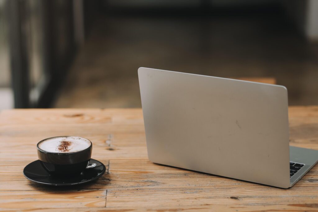 Closeup of coffee cup on table in empty corporate conference room before business meeting in office Stock Free