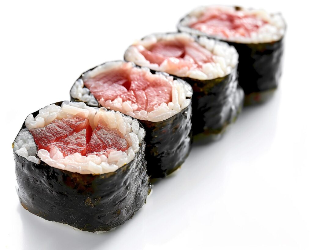 sushi rolls with meat and rice on a white background Stock Free