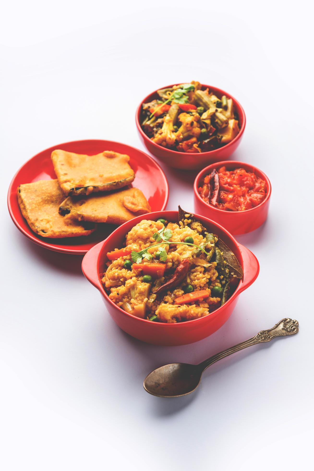 Bengali Bhog food for Indian Hindu Durga Puja or pooja festival. Khichadi, labra, tomato chutney Stock Free