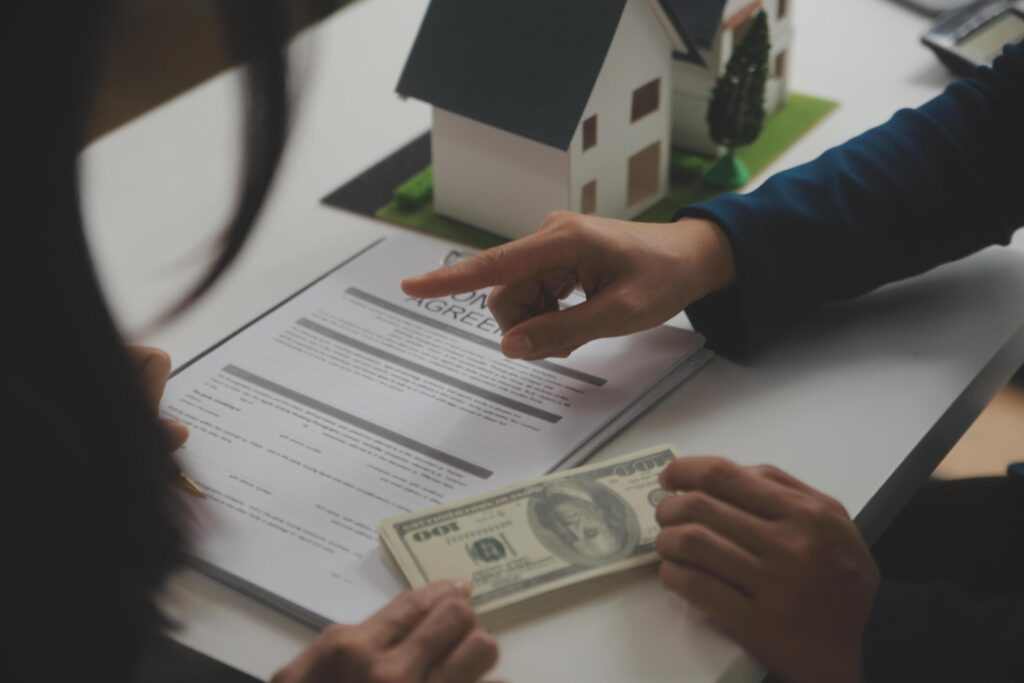 Business Signing a Contract Buy – sell house, insurance agent analyzing about home investment loan Real Estate concept. Stock Free