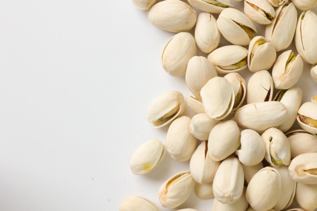 Pistachios nuts seeds on white background Stock Free