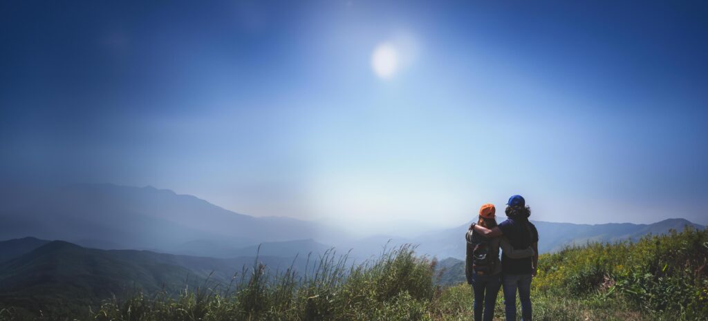 Lover women and men asians travel relax in the holiday. Stand up landscape on the Moutain. Mountain Park happily. In Thailand Stock Free