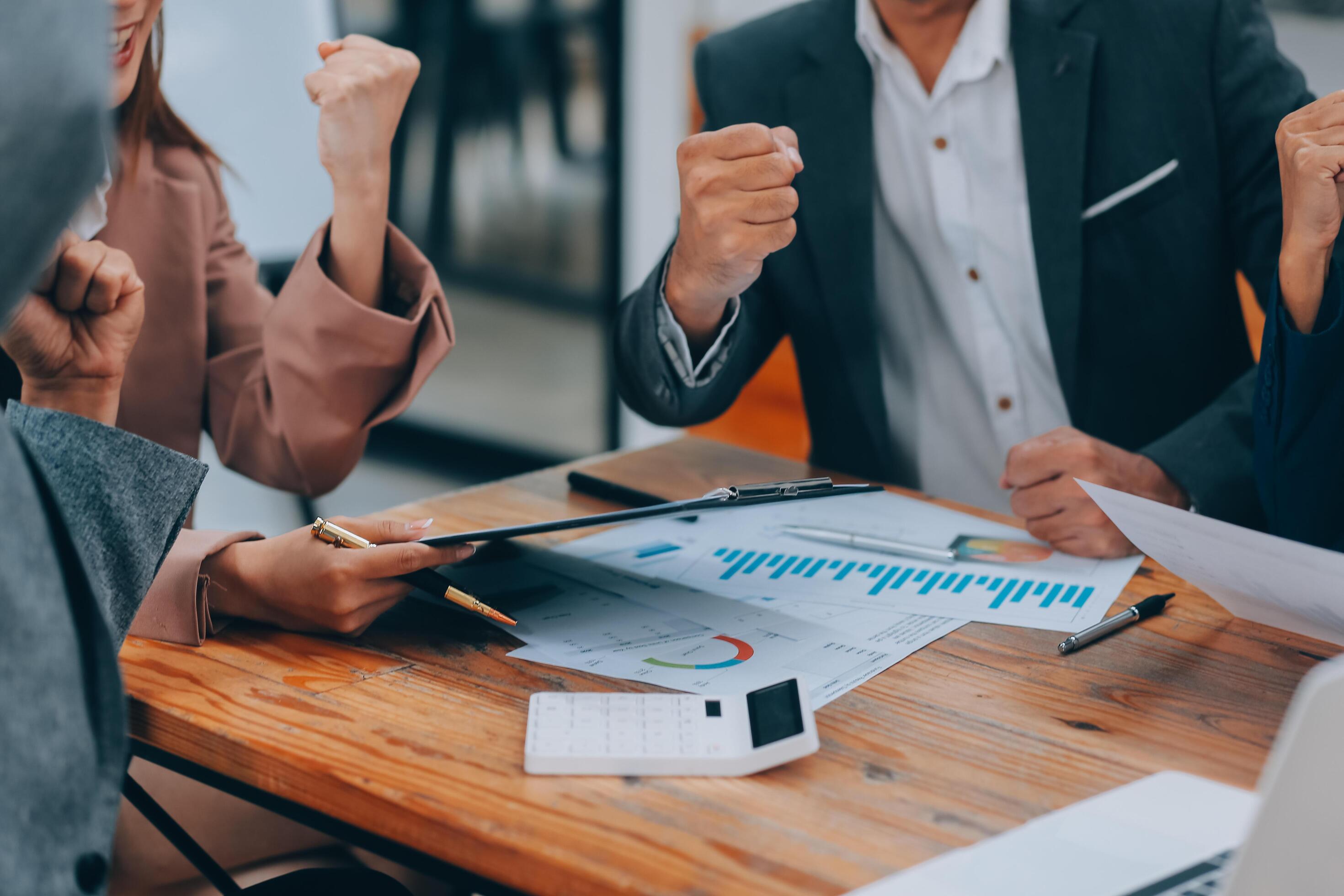 group of four happy young asian corporate people teammates meeting discussing business in office. Stock Free