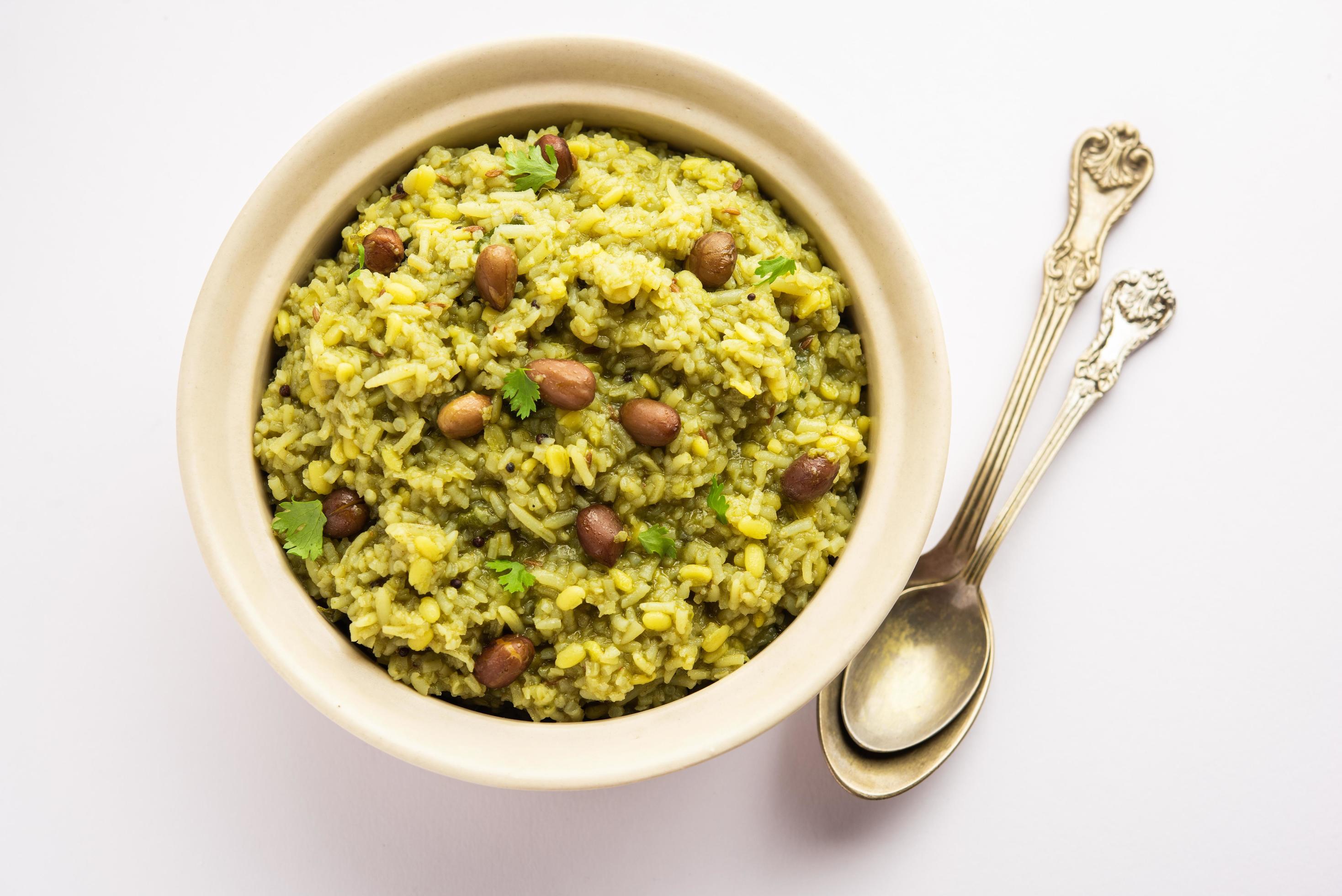 Palak khichdi is a one pot nutritious meal of mung lentils and rice with spinach, Indian food Stock Free