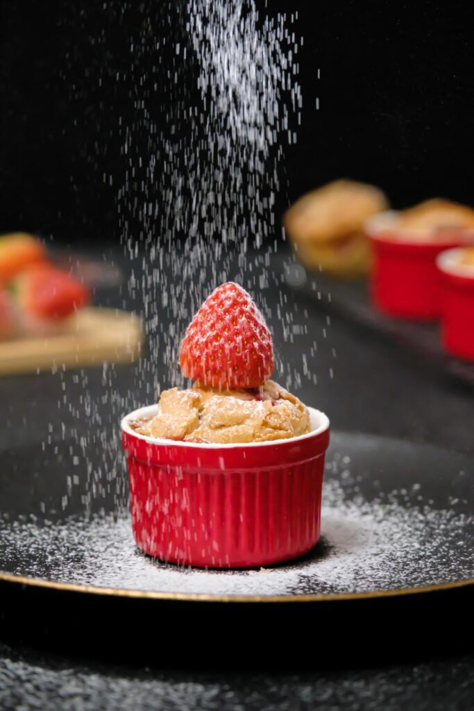 Homemade Strawberry cake topping with icing sugar. Sweet food. Sweet dessert. perfect summer season dessert served on plate. Stock Free