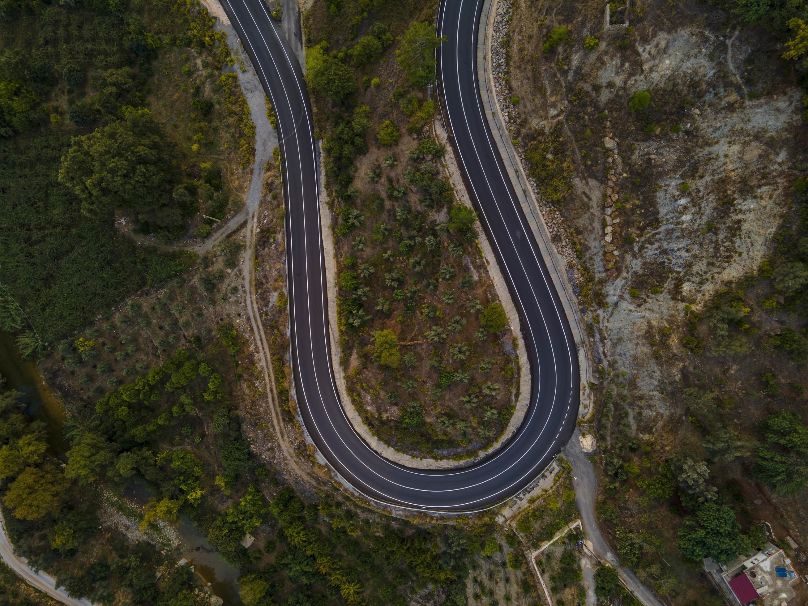 aerial valley and road, Top view, amazing nature background. sunset Flying drone, seascape Stock Free