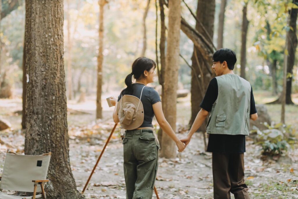 Asian couple sweet in tent inside on they camping trip, traveller relax and sleep togather in out door and camping trip Stock Free