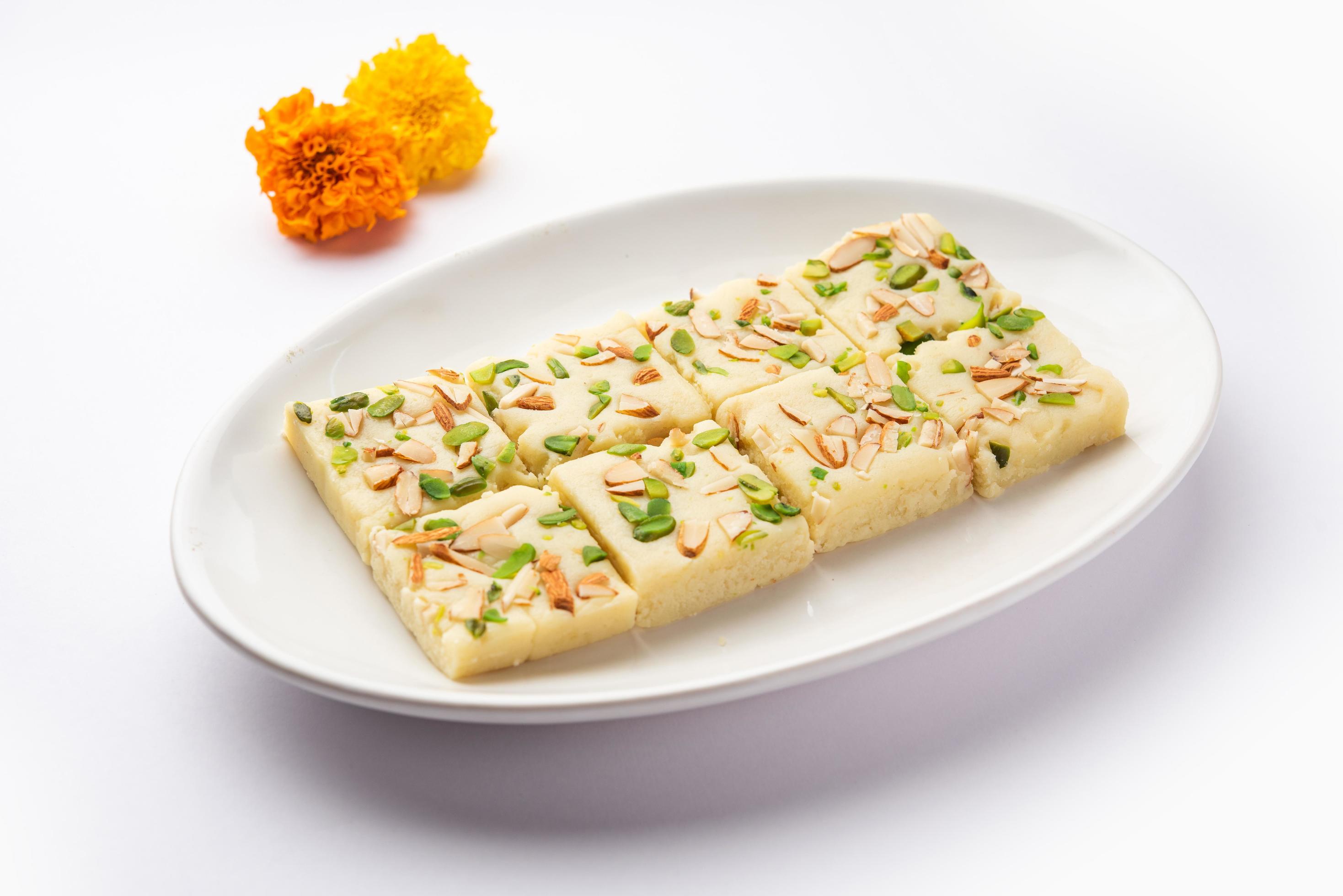 Milk powder barfi also known as Mava burfi, white Khoya burfi or Barfee, Indian Sweet food Stock Free