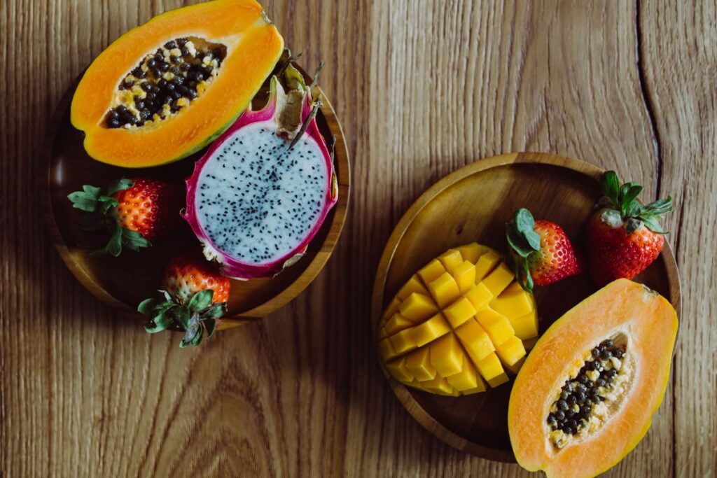 Exotic fruits on a wooden table Stock Free