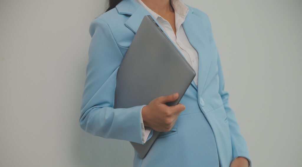 Portrait of a happy asian businesswoman working on laptop computer isolated over white background Stock Free