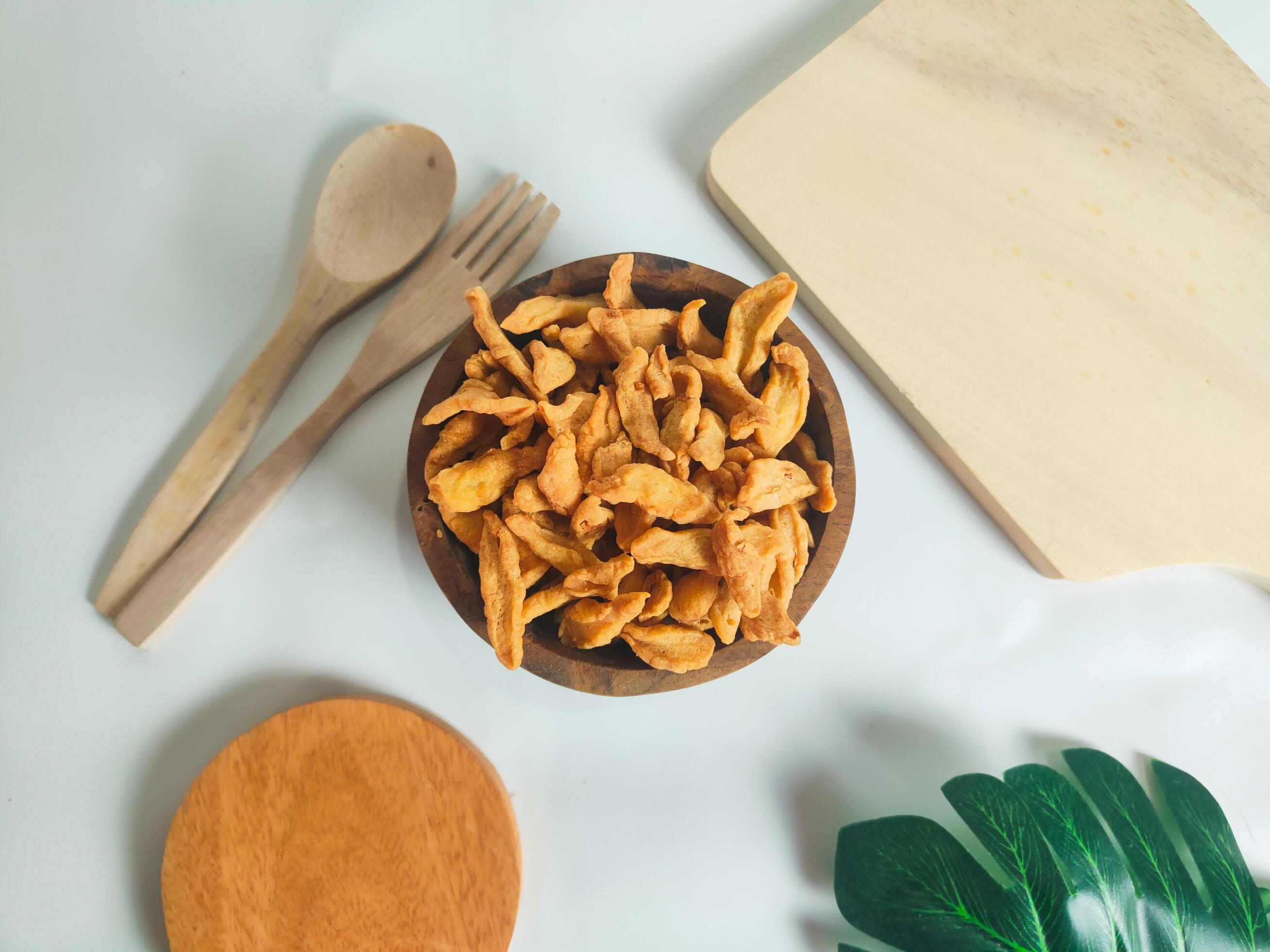 photography of cimi-cimi snack food in a wooden bowl on a white background Stock Free