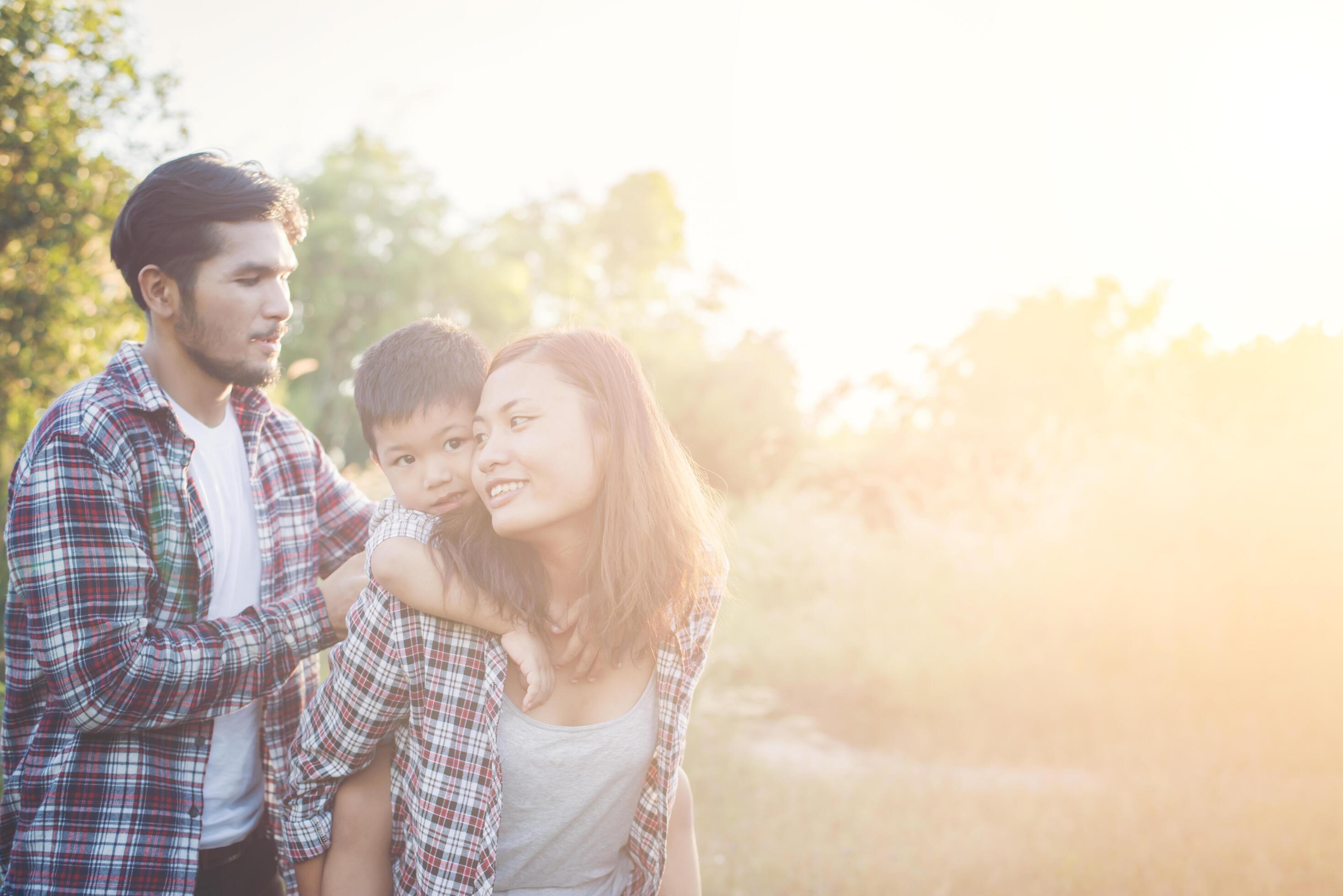 Happy young family spending time together outside. Family love concept Stock Free