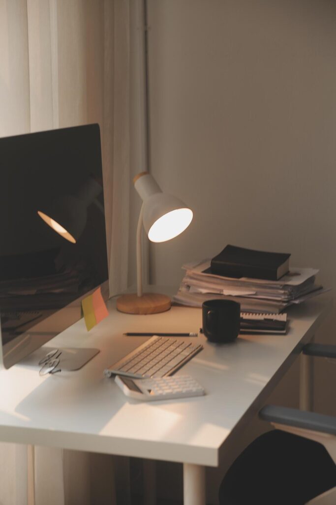 messy office workspace. Messy and cluttered office desk. Messy business office with piles of files and disorganized clutter. Stock Free