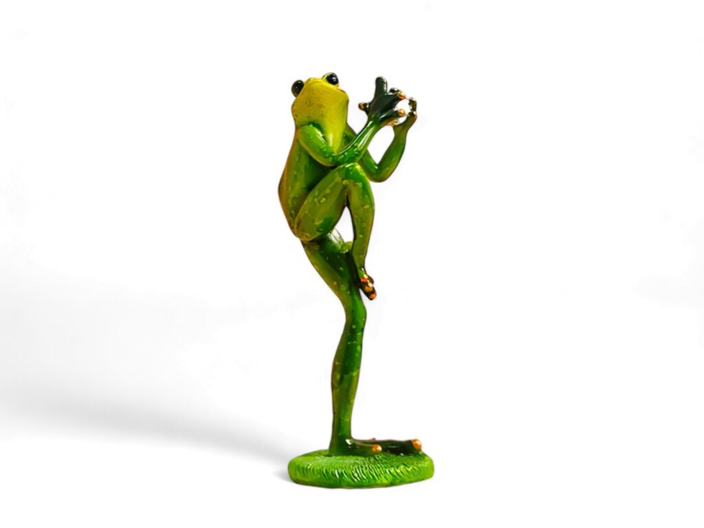 Miniature green frog animal playing baseball on a white background Stock Free