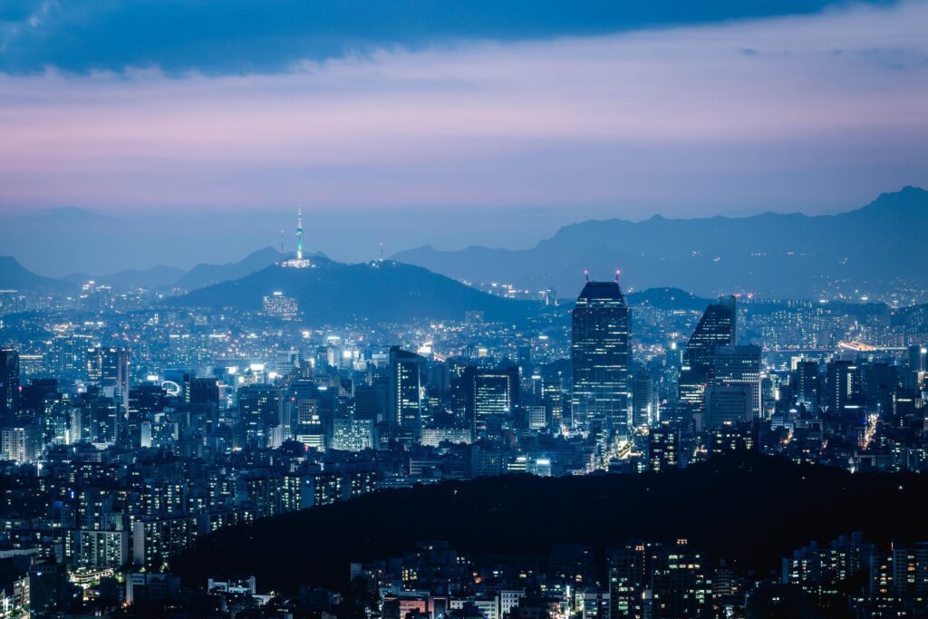 Seoul City skyline and skyscrapers View of Seoul at night in Gangnam District area There is Namsan Mountain in the background, South Korea. Stock Free